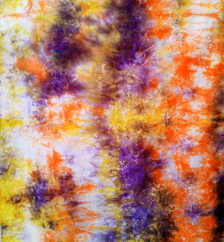 Tissus motif keren  couleur violet jaune orange et blanc 